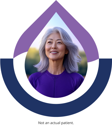 Smiling woman with long gray hair wearing a purple top. Caption below reads “Not an actual patient.”